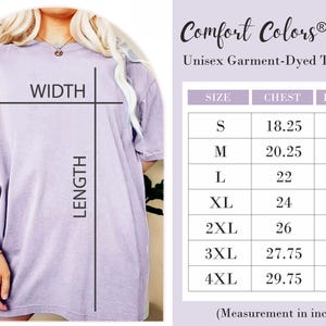 May include: A light purple Comfort Colors 1717 unisex garment-dyed t-shirt. The image includes a size chart with chest and length measurements in inches. The shirt is shown on a person.