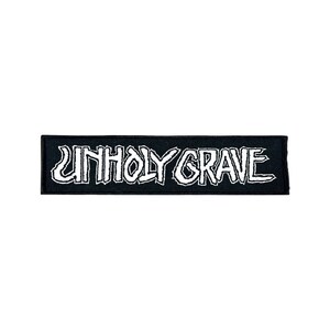 May include: Black and white embroidered patch with the text "UNHOLY GRAVE" in a jagged font.