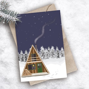 Carte de voeux pour cabane de Noël | pins | cabane en rondins | forêt enneigée | carte de Noël illustrée