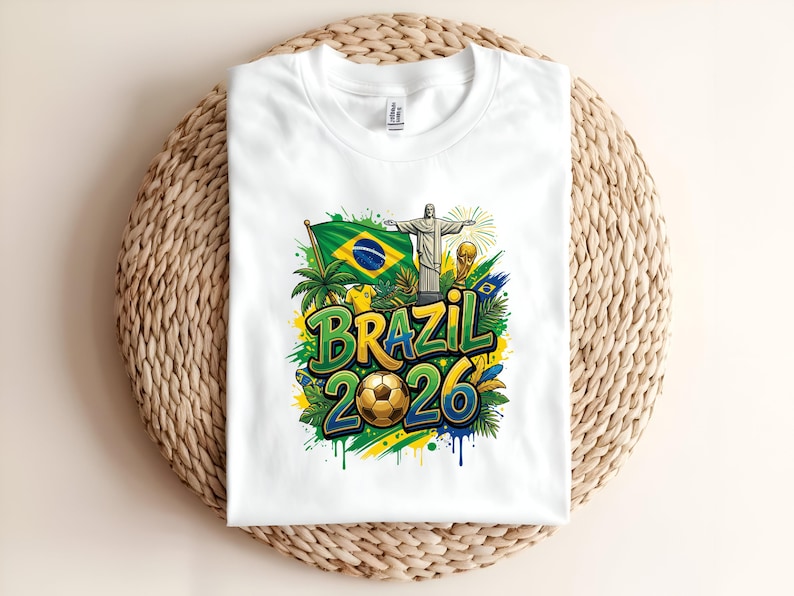 White t-shirt with "BRAZIL 2026" text, football, and Brazilian flag.
