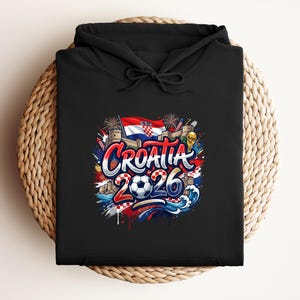 Black hoodie with "Croatia 2026" graphic featuring flag and soccer elements.