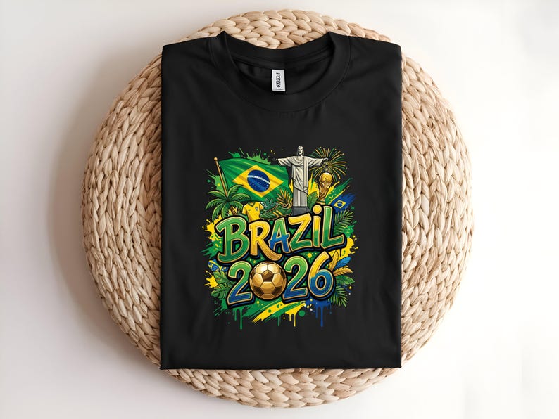 Black t-shirt with "Brazil 2026" text, soccer ball, flag, and Christ the Redeemer statue.