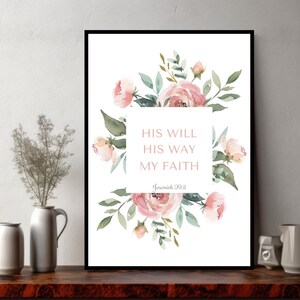 Pode incluir: Uma impressão em aquarela com flores cor-de-rosa e folhas verdes. A impressão apresenta o texto "Sua Vontade Seu Caminho Minha Fé" com a referência bíblica "Jeremias 29:11".