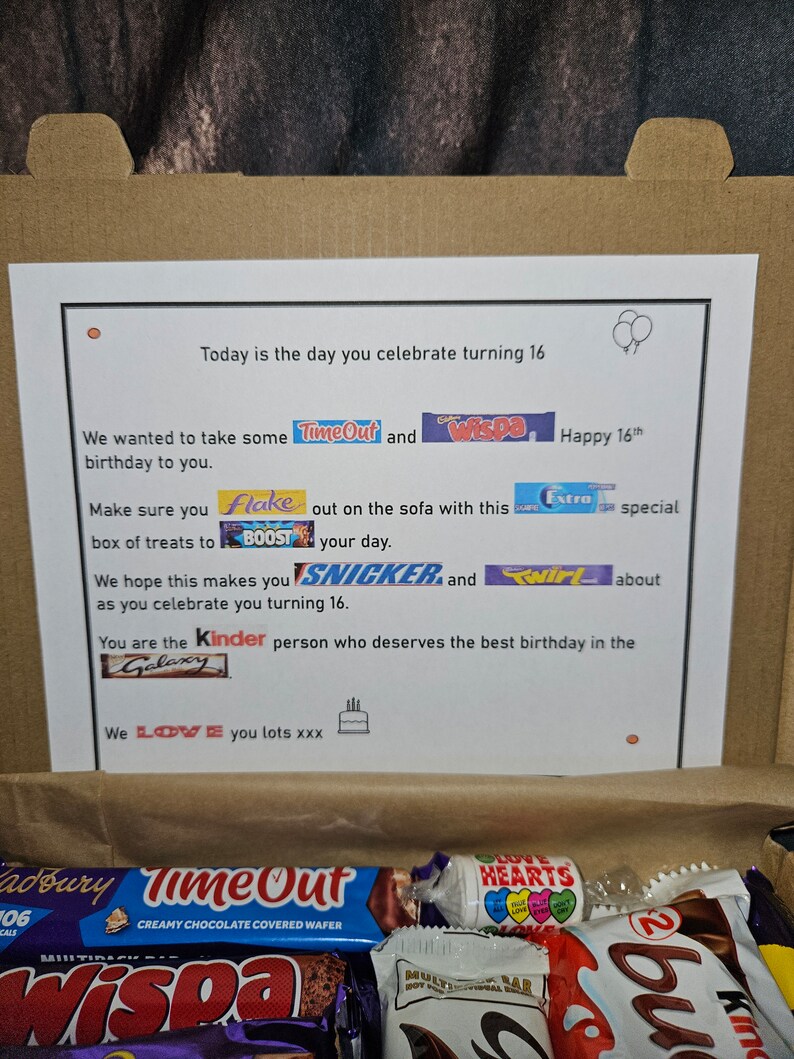 May include: A brown cardboard box filled with a variety of chocolate bars, including Wispa, Twirl, Snickers, and Kinder. The box also includes a bag of Love Hearts candies and a birthday card with the text "Today is the day you celebrate turning 16. We wanted to take some TimeOut and Wispa Happy 16th Make sure you Flake out on the sofa with this Extra special box of treats to BOOST your day. We hope this makes you SNICKER and Twirl about as you celebrate you turning 16. You are the Kinder person who deserves the best birthday in the Galaxy We LOVE you lots xxx"