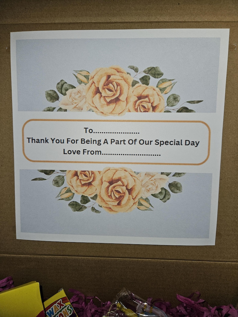 May include: A light blue card with a floral design featuring yellow roses and green leaves. The card has the text "To...... Thank You For Being A Part Of Our Special Day Love From...."