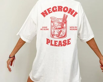 May include: White t-shirt with a red graphic of a Negroni cocktail and the text "Leave me alone with my Negroni please".