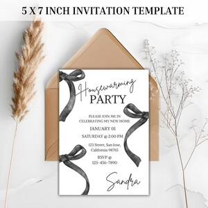 May include: A black and white housewarming party invitation with a black ribbon bow design. The invitation includes the text "Housewarming Party", "Please join me in celebrating my new home", "January 01", "Saturday @ 2:00 PM", "123 Street, San Jose, California 98765", "RSVP @ 123-456-7890", and "Sandra".