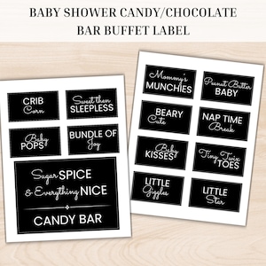 May include: Two sheets of black and white baby shower candy bar buffet labels. The labels include phrases like "Mommy's Munchies", "Baby Kisses", and "Sugar Spice & Everything Nice". The text "Baby Shower Candy/Chocolate Bar Buffet Label" is at the top.