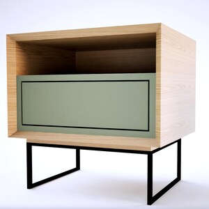 May include: A wooden nightstand with a light green drawer and a shelf. The nightstand has black metal legs.