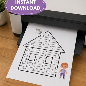 May include: A white sheet of paper featuring a black line drawing of a house-shaped maze, a small illustration of a cat on the roof, and a cartoon character wearing a purple striped shirt and pants standing to the right of the house structure.