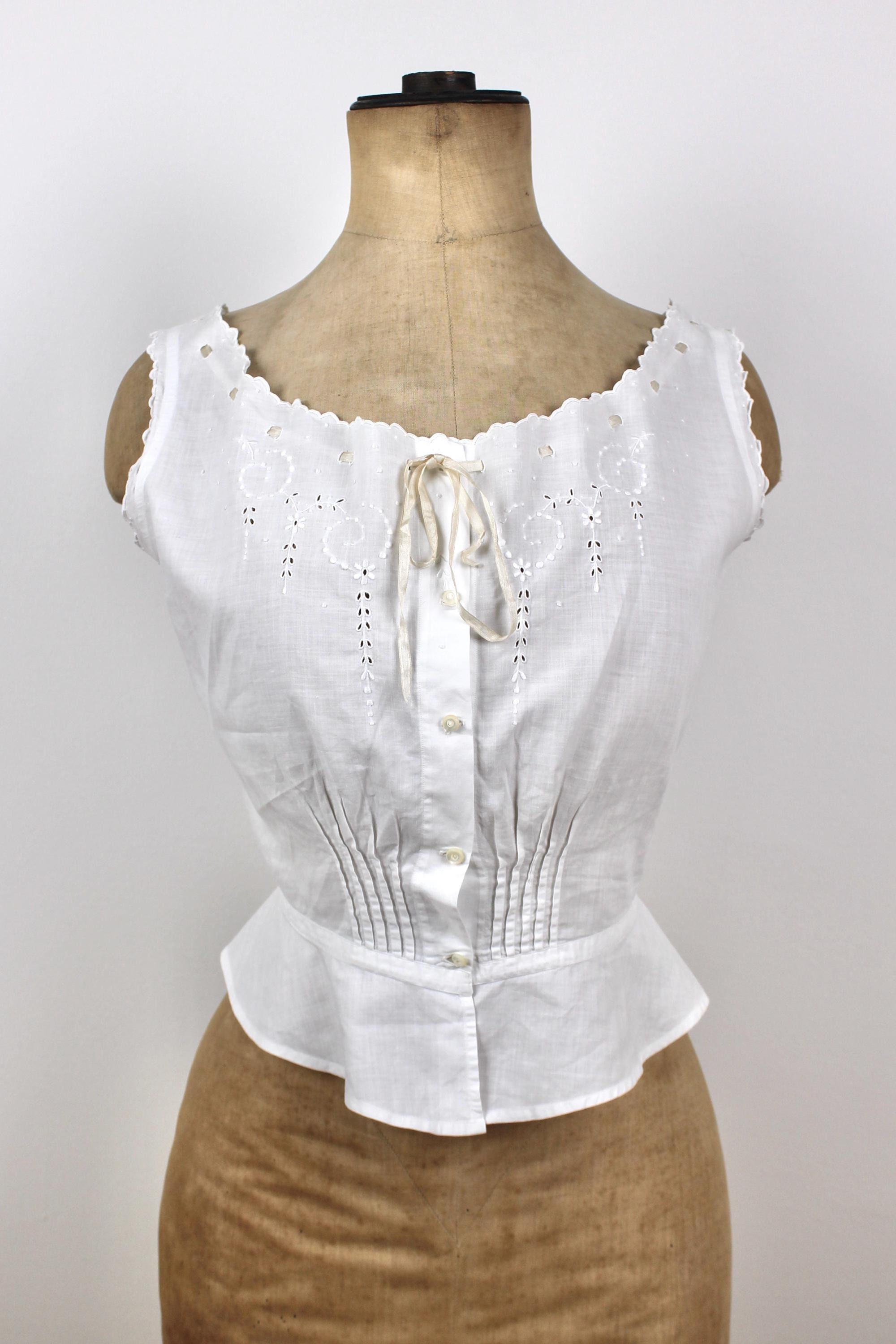 I found what I believe is an early 1900s corset cover at a