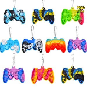 May include: Ten colourful silicone fidget toys shaped like video game controllers with keychains. Each toy has a different colour combination and pattern.