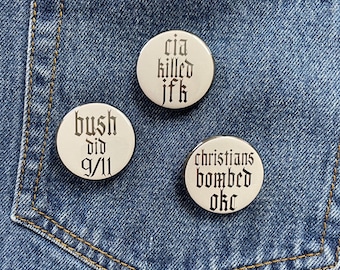 conspiracy theories? * anti-establishment 1.25 inch pins * multiple designs