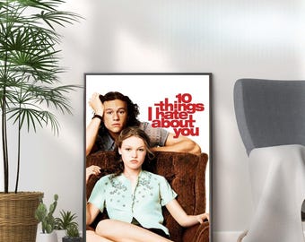May include: A movie poster for the film "10 Things I Hate About You" featuring Heath Ledger and Julia Stiles. The poster is black and white with red text.