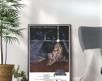 May include: A vintage Star Wars movie poster featuring a black and white image of Darth Vader, Luke Skywalker, and Princess Leia. The poster has the text "A long time ago in a galaxy far, far away..." at the top and "Star Wars" in large letters at the bottom.