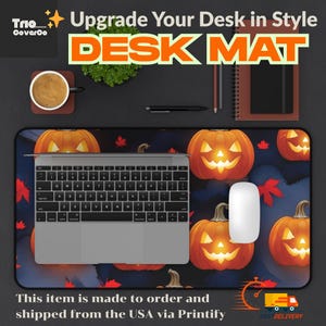 May include: A Halloween desk mat with orange jack-o'-lanterns on a dark blue background. The mat has the text "DESK MAT" and "Upgrade Your Desk in Style". A laptop, mouse, and other desk accessories are on the mat.