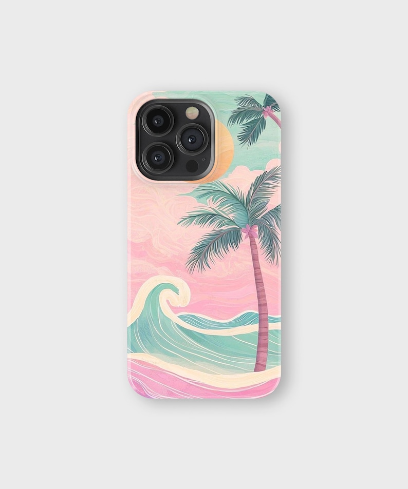 May include: A phone case featuring a watercolor illustration of a beach scene. The design includes a pink and blue sky, a turquoise wave, a sandy shore, and palm trees. The case has a pastel color palette.