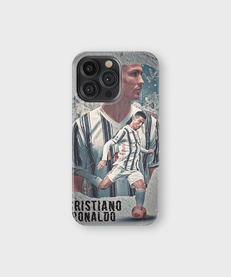 May include: A phone case featuring a collage of Cristiano Ronaldo in a soccer uniform. The design includes a portrait and action shot of the soccer player, with the name "Cristiano Ronaldo" printed at the bottom. The case has a gray border.
