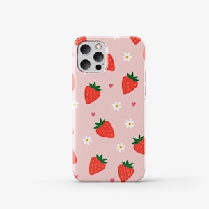 May include: A pink phone case with a pattern of red strawberries, white flowers, and pink hearts.