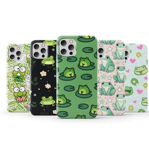 May include: Five different phone cases with frog designs. The cases are all black, green, and white. One case has a frog wearing a shirt and says "I want you to know". Another case has a frog in a lily pad with the text "Thank you".