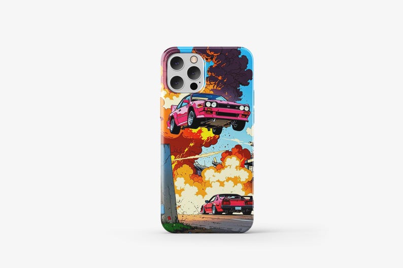 May include: A phone case with a colorful comic book style design featuring a pink car flying through the air with explosions and smoke. There is a second red car driving on the road below.