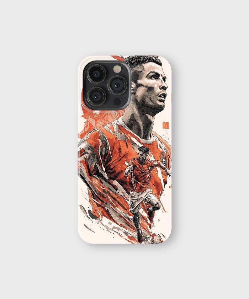 May include: A phone case featuring a stylized illustration of a soccer player in a red and white uniform. The design includes a portrait of the player and a dynamic action shot, set against a cream-colored background.