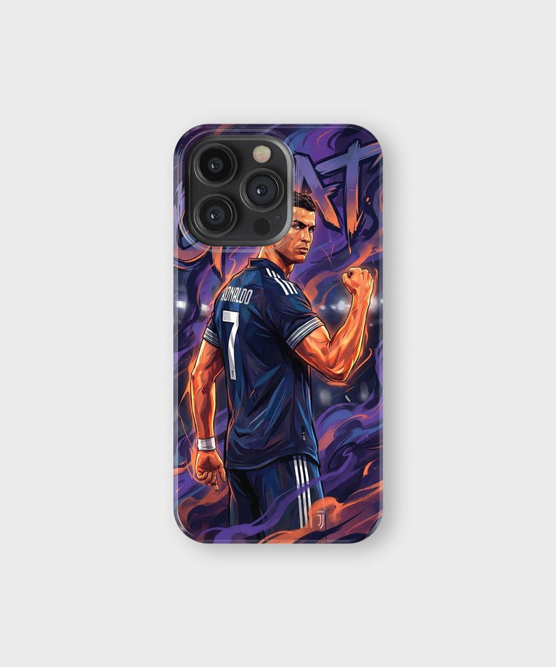 May include: A phone case featuring a stylized illustration of a soccer player in a dark blue jersey with the number 7 and the name "RONALDO". The background has purple and orange smoke-like effects.