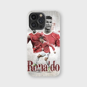 May include: A phone case featuring a collage of Cristiano Ronaldo in a red jersey. The design includes multiple images of the soccer player, with the name "Cristiano Ronaldo" printed in a stylized font.