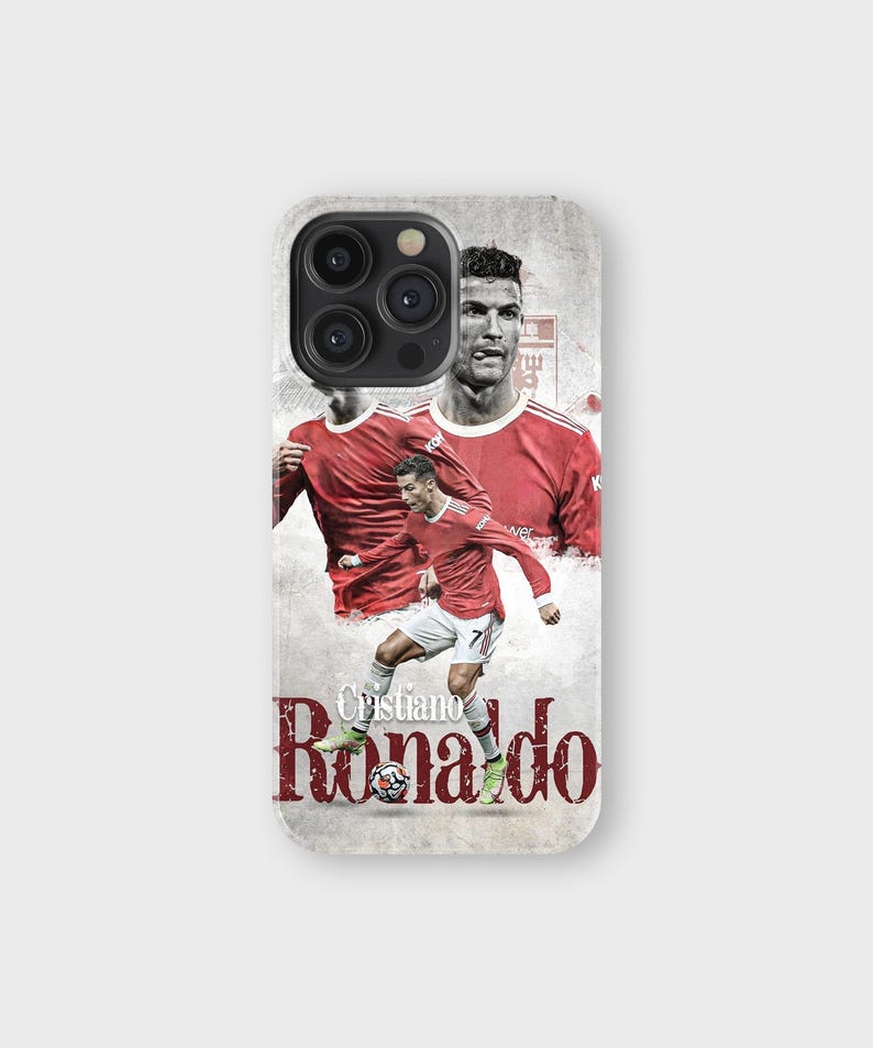 May include: A phone case featuring a collage of Cristiano Ronaldo in a red jersey. The design includes multiple images of the soccer player, with the name "Cristiano Ronaldo" printed in a stylized font.