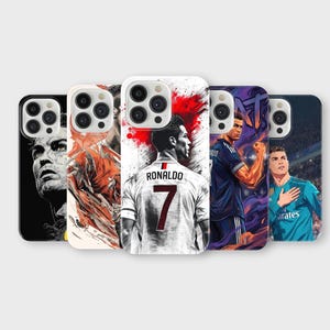 May include: A collection of phone cases featuring artistic portraits of a soccer player. The cases display various action poses and close-ups, with a focus on the player's jersey and facial expressions. The cases are in different colors.