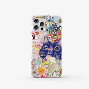 May include: A colourful phone case featuring a collage of stickers and a blue cat with yellow eyes. The cat is the main focus of the design and is looking directly at the viewer.