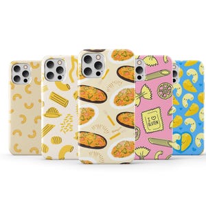 May include: Five different iPhone cases with various pasta-themed designs. The cases are all white with different colored pasta designs. One case has a design of pasta with the text "I love gluten".