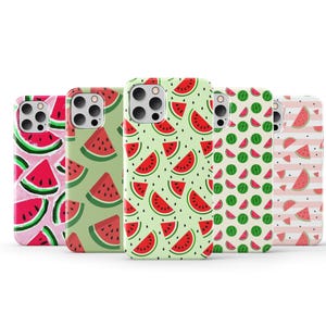 May include: Five different phone cases with watermelon designs. The cases are all for the same phone model and have different patterns of watermelons on a green, pink, or white background.