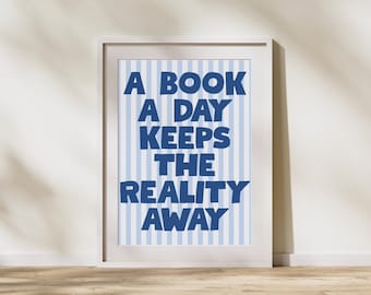 May include: A white framed print with blue and white stripes. The text on the print reads "A book a day keeps the reality away."