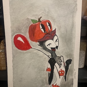 May include: Watercolour painting of a cartoon wolf wearing a red apple hat and holding a red balloon. The wolf is wearing a white shirt with a red apple design. The background is a light grey.