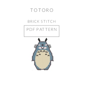 May include: A PDF pattern for a brick stitch Totoro embroidery project. The pattern features a blue and beige Totoro with a smiling face.