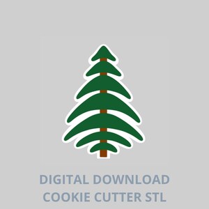 以下が含まれることがあります： 白い縁取りのある緑色のクリスマスツリーのクッキーカッターのデザイン。木には茶色の幹と枝があります。「DIGITAL DOWNLOAD COOKIE CUTTER STL」というテキストが灰色の背景の下にあります。