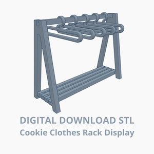 Op de afbeelding: Een lichtblauw koekjeskledingrekdisplay met een lattenplank en geïntegreerde hangers. Het rek is gemaakt van hout en heeft een eenvoudig, modern ontwerp. De tekst "DIGITAL DOWNLOAD STL Cookie Clothes Rack Display" staat onderaan.
