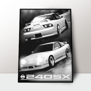 May include: Black and white print of two white sports cars in motion. The cars are angled, with headlights illuminated, and appear to be drifting. The text "240SX" is at the bottom of the print.