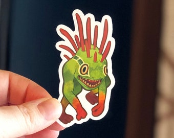 Peut inclure: Autocollant de monstre de dessin animé vert et rouge avec une crête rouge hérissée. Le monstre a un sourire narquois et marche sur deux jambes.