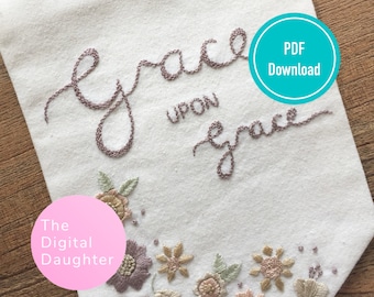 May include: Embroidered white fabric banner with the text "grace upon grace" in cursive script. The banner has a floral border with pink, green, and yellow flowers. The text "The Digital Daughter" is on a pink circle in the lower left corner. The text "PDF Download" is on a teal circle in the upper right corner.