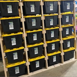 May include: A wooden storage shelf with multiple black and yellow storage bins. The shelf is made of natural wood and has a rustic look.