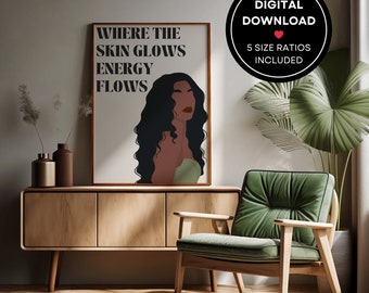 May include: A digital download of a printable wall art print featuring a woman with long, dark hair and a green top. The text on the print reads "Where the skin glows energy flows".
