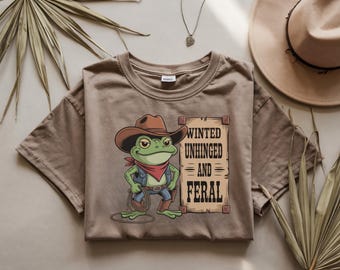 Comfort Colors ®Wanted Unhinged and Feral Shirt – Funny Cowboy Frog Graphic Tee for Meme Lovers, Weird Western Aesthetic Gift Idea