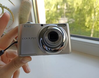 Fotocamera digitale compatta Nikon Silver Coolpix L22 12.0MP FUNZIONANTE A BUON MERCATO LEGGI!!!