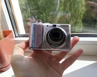 RARE PINK Canon PowerShot A1100 IS 12.1MP digital compact camera WORKing CHeAP ReAD!!!