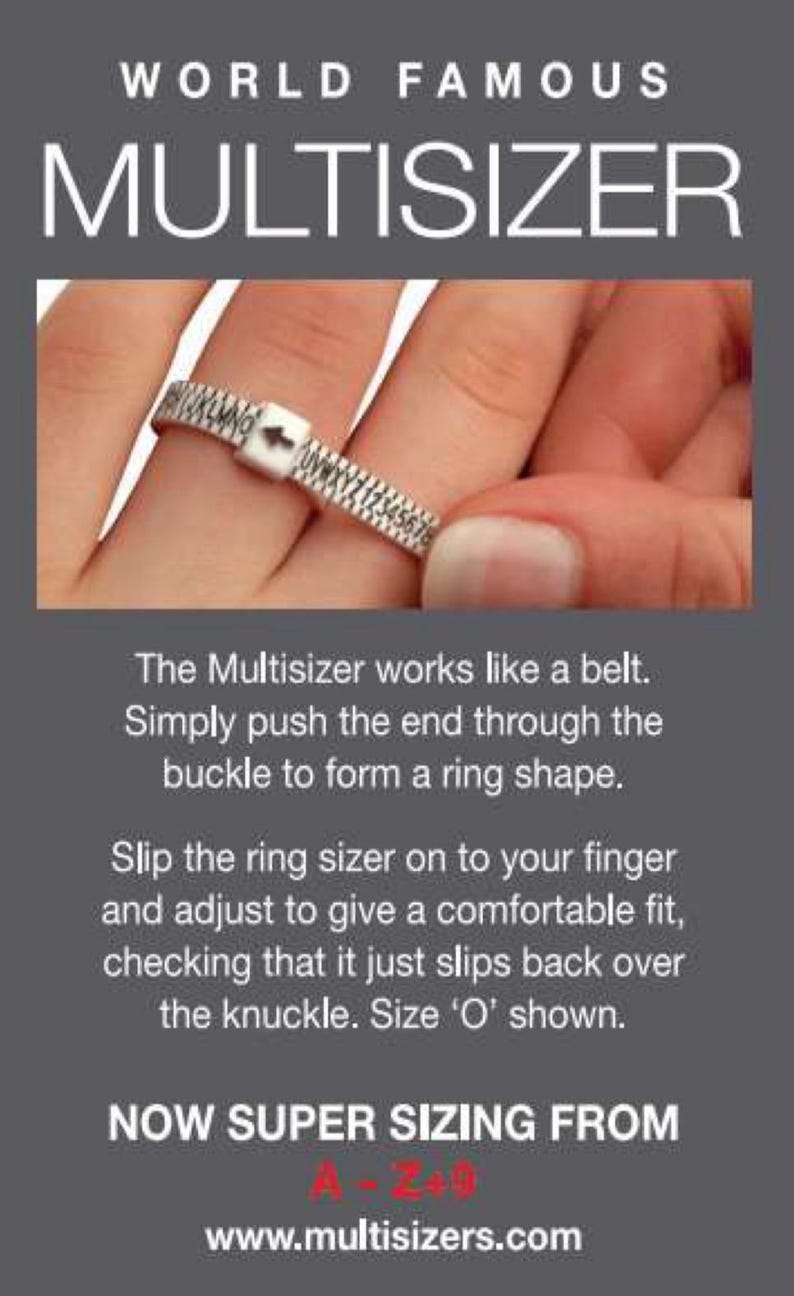 May include: A silver ring sizer with a buckle closure. The sizer is marked with letters and numbers. The text on the image reads "WORLD FAMOUS MULTISIZER" and "NOW SUPER SIZING FROM A - Z + 0" and "www.multisizers.com".