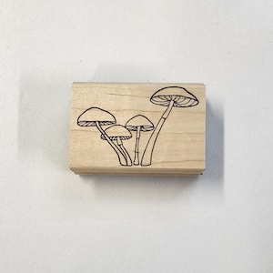 Tampon en caoutchouc pour groupe de champignons
