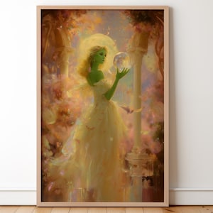 Puede incluir: Una impresión artística enmarcada representa a una mujer con piel verde y cabello rubio con un vestido amarillo fluido, sosteniendo una bola de cristal. La obra de arte tiene una calidad suave y etérea con una paleta de colores cálidos de amarillos, naranjas y rosas. También hay mariposas y elementos arquitectónicos.