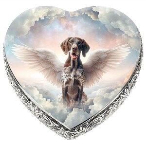 May include: A heart-shaped silver keepsake box with a white and brown German Shorthaired Pointer dog with angel wings against a cloudy sky background.